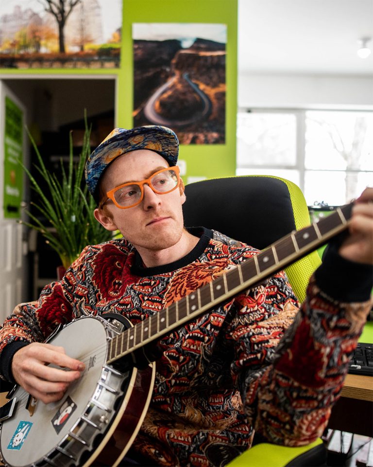 Portrait of a print shop owner in their Ottawa, Ontario workshop, photographed by Cyrus Media.
