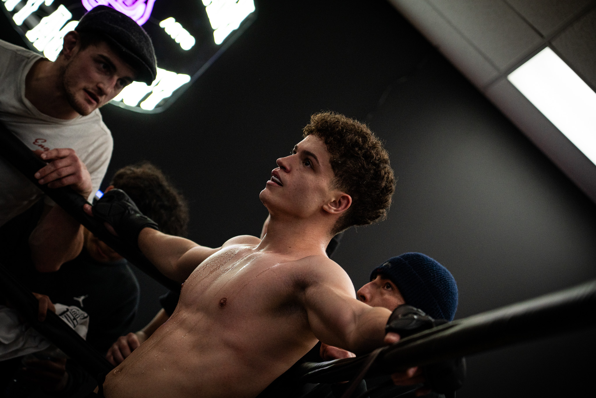 Mixed martial arts fighter standing in the corner of the ring after several rounds during an amateur fight night at A Foot Above Fitness gym